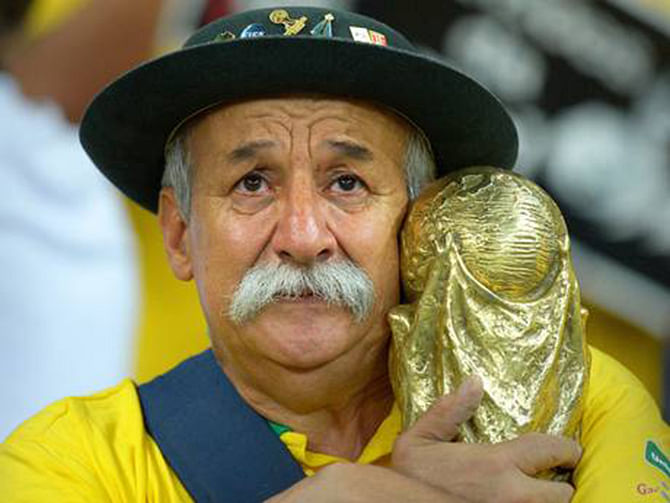 A Brazilian fan shows his dejection after the semi final defeat. The photo is taken from independent.co.uk