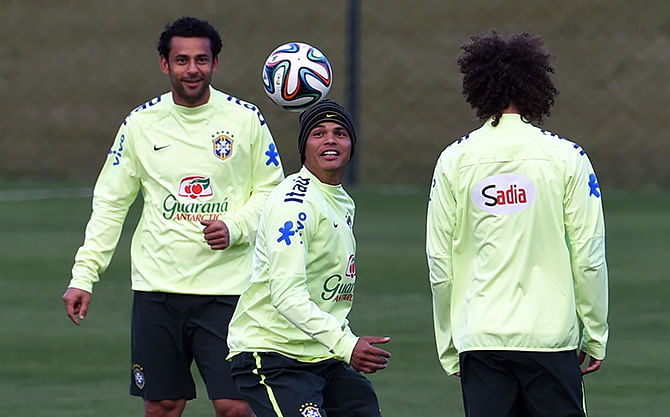 (L-R) Brazil's forward Fred, Brazil's defender and captain Thiago Silva and Brazil's defender David Luiz take part in a training session at the Granja Comary training complex in Teresopolis on July 6, 2014 during the 2014 FIFA World Cup in Brazil. Photo: AFP/ Getty Images
