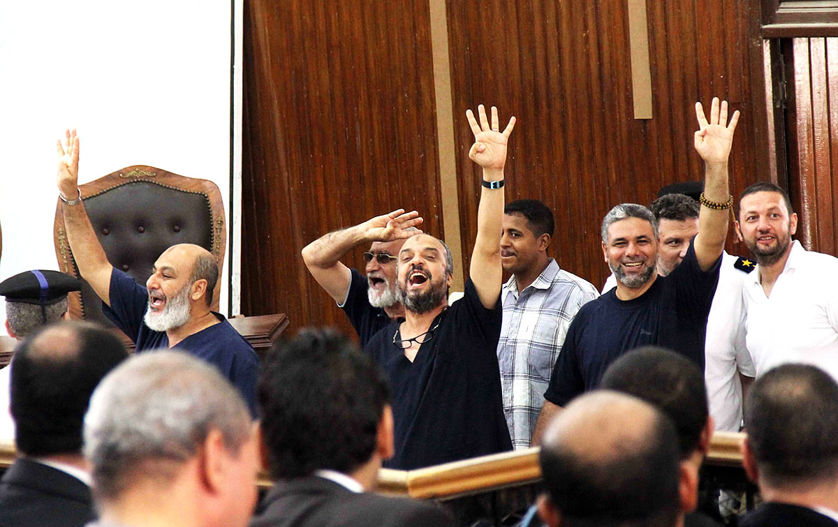 Mohammed Badie (2nd L), Supreme Guide of the Muslim Brotherhood, Mohamed Beltagy (3rd L), general secretary of the Freedom and Justice Party, and Safvet Hicazi (L), one of the anti-coup leaders of the National Alliance, were sentenced to life imprisonment. Photo: Getty Images