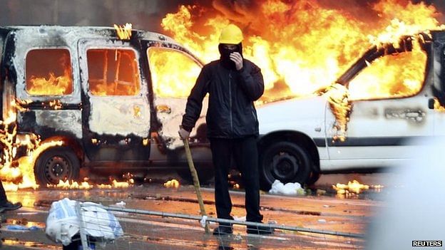 Vehicles were set alight when violence erupted after the march. Photo: Reuters