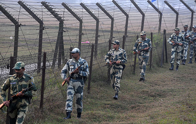 Indian Border Security Force (BSF) personnel patrol the border with Bangladesh near the Fulbari Border post, some 20kms from Siliguri on January 4, 2014. Photo: Getty Images