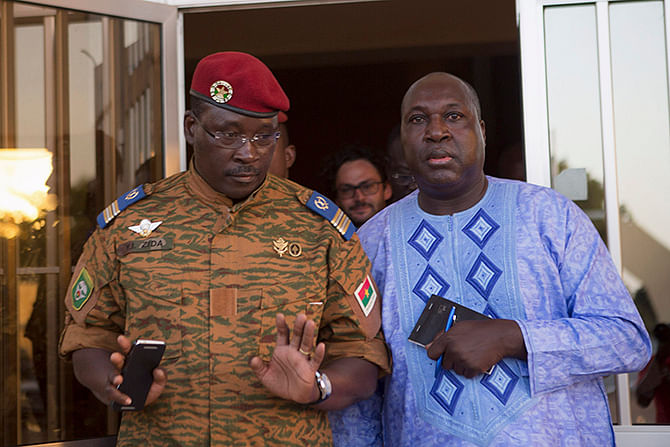 Lieutenant Colonel Yacouba Isaac Zida (L) meets with opposition leader Zephirin Diabre in Ouagadougou, capital of Burkina Faso, November 2, 2014
