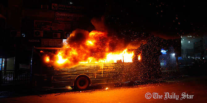 Miscreants set fire to the government bus at Purana Paltan intersection in Dhaka Sunday evening. Photo: SK Enamul Haq