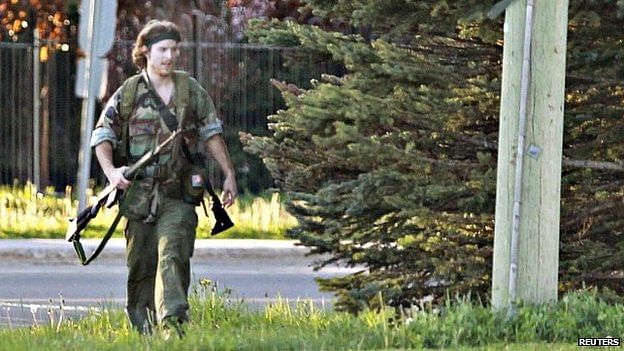 A heavily armed man identified as Justin Bourque was photographed in Moncton at the time of the shootings