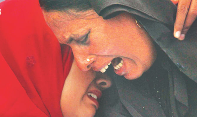 Relatives of victims break down in tears during a civil demonstration against extrajudicial killings and disappearances in front of the Jatiya Sangsad Bhaban on May 5. Star file photo