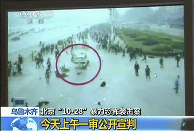 The footage of an October attack on the edge of Beijing's Tiananmen Square is seen in court during the trial of three people involved in this still image taken from video in Urumqi city, in this June 16, 2014 file photo. Photo: Reuters