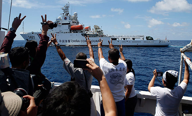 A Chinese Coast Guard vessel manoeuvres to block a Philippine government supply ship with members of the media aboard at the disputed Second Thomas Shoal, part of the Spratly Islands, in the South China Sea on Saturday. Photo: Reuters