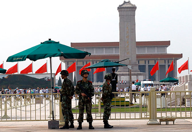 Paramilitary soldiers stand guard in front of Tiananmen Square in Beijing on Wednesday. China to mark 25 years since authorities opened fire on student-led protests in Tiananmen Square, and as the anniversary approached, authorities have deployed hundreds of police, many armed with rifles, to patrol the area. Photo: Reuters