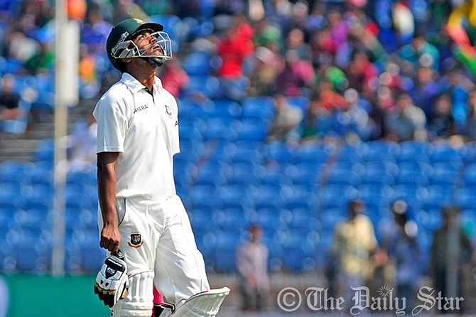 Frustrated Bangladesh opener Shamsur Rahman goes back to pavilion after Zimbabwe’s Elton Chigumbura traps him lbw during the second Test in Khulna today. Photo: Firoz Ahmed