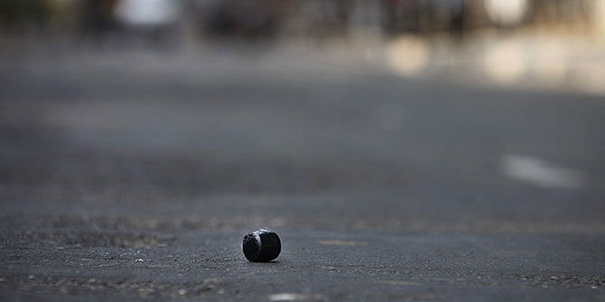 In this Star file photo, a crude bomb lies in an abandoned condition on a road in Dhaka city during a hartal period.