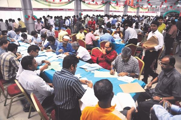 This Star photo taken on June 6, 2013 shows sufficient numbers of tax officials and staff helping citizens file their tax returns in a cordial environment at the tax fair.