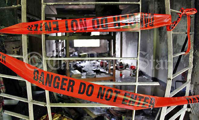 This Star file photo taken on October 9, 2013 shows police tapes cordoning off the burnt room of the madrasa after an explosion took place inside it.