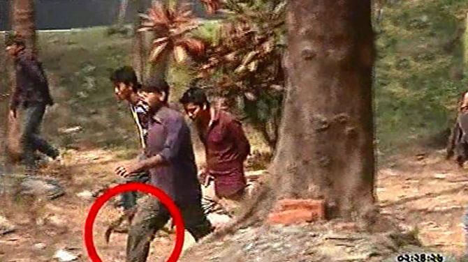 An activist of Bangladesh Chhatra League is seen holding a machete (marked with a red circle) during a clash of two rival groups at Chittagong University on Sunday. The photo has been taken from Somoy TV channel.