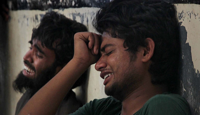 Classmates break down in tears as Taposh Paul, a first-year Chittagong University student, shot in a factional clash of Bangladesh Chhatra League, is declared dead at Chittagong Medical College and Hospital Sunday. Photo: STAR