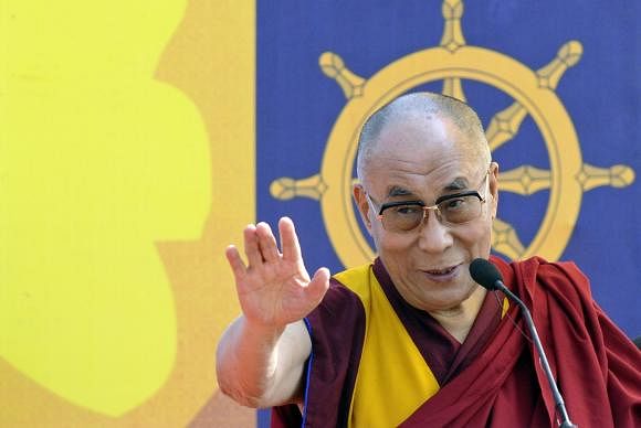 Exiled Tibetan spiritual leader, the Dalai Lama, addresses a gathering with the theme ''A Human Approach to Peace and the Individual'' at a stadium in the northeastern Indian city of Guwahati February 2, 2014.
