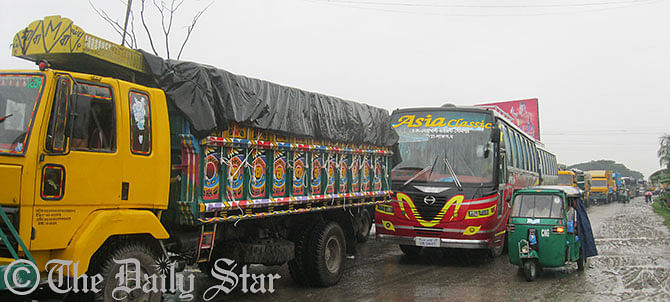 In this September 20 Star photo, vehicles get stuck on Dhaka-Chittagong highway in Daudkandi upazila of Comilla after a road accident. The photo is taken at Pennai area of the upazila.