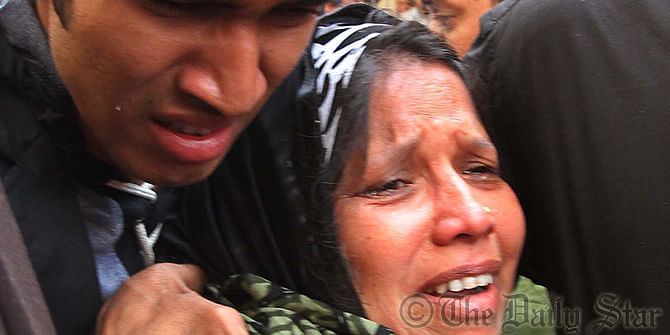 Family of Deen Mohammad, one of the convicts of 10-truck arms haul case who has received death penalty verdict, break down in tears after the verdict outside the Chittagong court premises today. Photo: Anurup Kanti Das