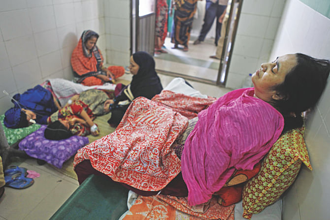 Three of the nine people, drugged by a house help in the capital's Chawkbazar, undergoing treatment at Dhaka Medical College Hospital yesterday. Photo: Star