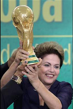  In this June 2, 2014 file photo, Brazil's President Dilma Rousseff holds up the 2014 World Cup trophy after it was officially presented to Rousseff by FIFA President Sepp Blatter, during a ceremony at the Planalto presidential palace, in Brasilia, Brazil. Photo: AP 