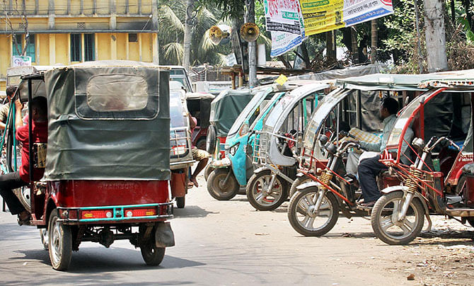 This Star file photo taken on May 17 shows Easy bikes plying Chittagong city roads rampantly. 