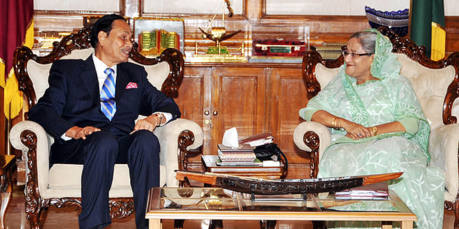 This October 20, 2013 PMO photo shows Jatiya Party Chairman HM Ershad meets Prime Minister Sheikh Hasina at the Prime Minister’s residence, Gono Bhaban in the capital.