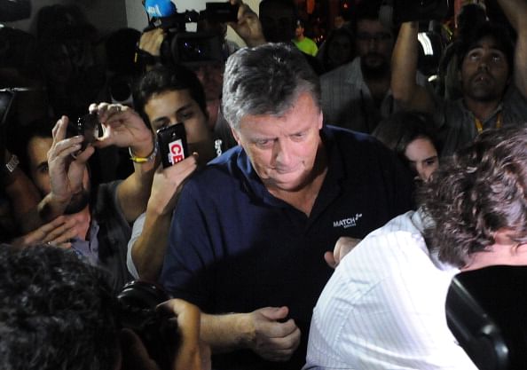 The CEO of Match Hospitality, a subsidary company of Fifa in charge of World Cup ticket packages, Raymond Whelan arrives at a police station in Rio de Janeiro after being arrested accused of leading a network that illegal sold game passes, on July 7, 2014 in Rio de Janeiro. Photo: Getty Images
