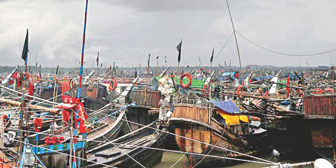 This Star photo taken on May 14, 2013 shows fishing boats are anchored on the coast in Cox’s Bazar.