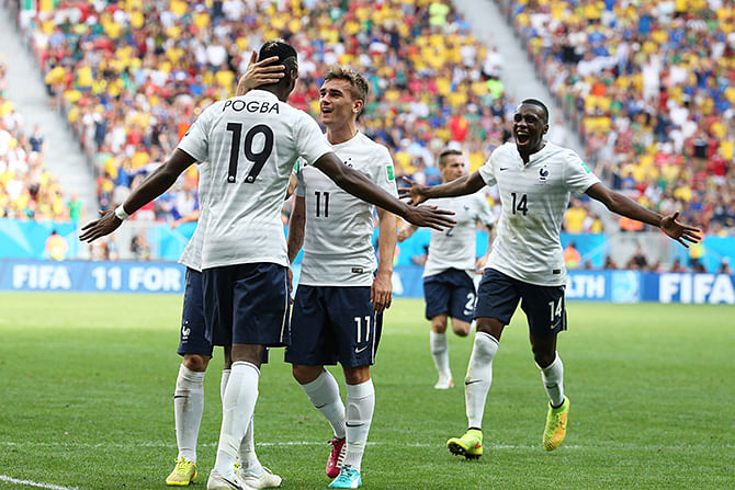 Paul Pogba of France celebrates scoring his team's first goal with his teammates Antoine Griezmann and Blaise Matuidi during the 2014 FIFA World Cup Brazil Round of 16 match between France and Nigeria at Estadio Nacional on June 30, 2014 in Brasilia, Brazil. Photo: Getty Images