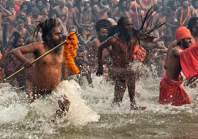 This Reuters file photo from last year shows Hindu holy men take a dip during the first “Shahi Snan” (grand bath) at the ongoing “Kumbh Mela”.