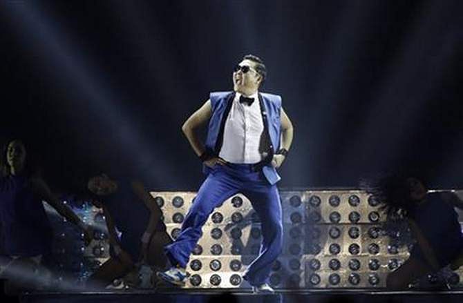 In this Sunday, December 22, 2013, file photo, South Korean rapper Psy performs during his concert 