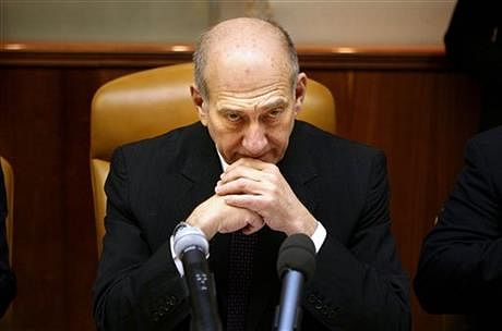 In this Sunday, Dec. 21, 2008, file photo, Israeli Prime Minister Ehud Olmert attends the weekly cabinet meeting in Jerusalem. The third Gaza war is playing out very much like the first one some five years ago: We are now at the stage where the harrowing civilian toll in Gaza is at the center of the discourse, eclipsing the rocket attacks by Hamas militants which are the reason for the Israeli assault. Photo: AP