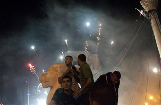 Palestinians launch fireworks during celebrations in the West bank city of Ramallah, late Sunday, July 20, 2014. Photo: AP 