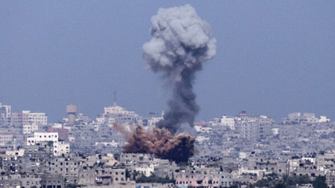 A picture taken from the southern Israeli-Gaza Strip border shows an explosion moments after an Israeli air strike on Gaza City on July 11. Photo: Getty Images 