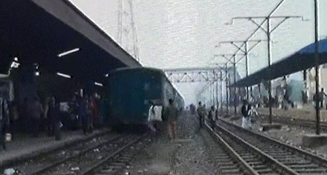A train which stands at Joydebpur Railway Station in Gazipur has been set afire by miscreants Thursday morning. Photo: TV grab 