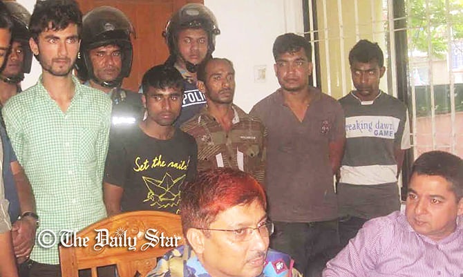Law enforcers produce the abductors, who were arrested in connection with kidnapping Akramul Alam Dipu from Gazipur, before media at the office of superintendent of police in Gazipur Friday noon. Photo: Star