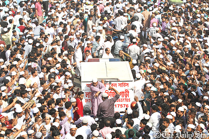 The vehicle is carrying the body of Ghulam Azam to the Baitul Mokarram mosque for namaz-e-janaza Saturday. Photo: Amran Hossain 