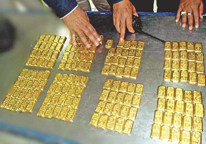 This November 27, 2013 Banglar Chokh photo shows 160 smuggled gold bars, weighing 27kg and worth about Tk 8 crore, seized by customs officials from a toilet bin of a flight from Malaysia, which arrived at Hazrat Shahjalal International Airport in the capital. 