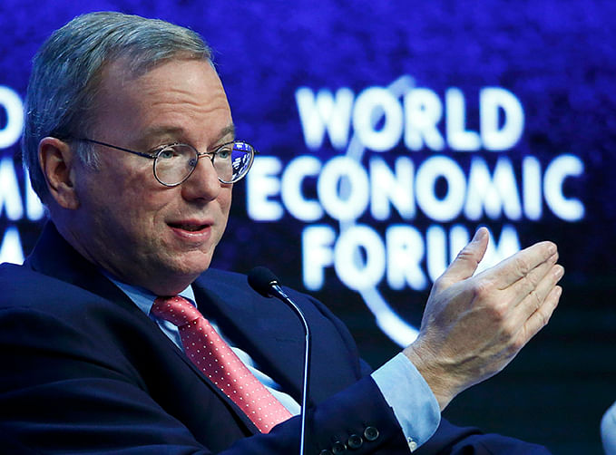 Eric Schmidt, Executive Chairman of Google, gestures during the session 