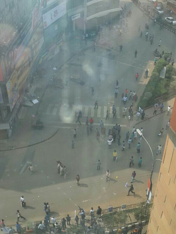 The aerial view shows people fleeing the place where two crude bombs go off near a rally led by Shipping Minister Shajahan Khan at Gulshan-2 in Dhaka. The photo is taken from in front of metropolitan shopping plaza Monday afternoon. Photo: Courtesy
