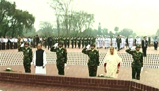 President Abdul Hamid and Prime Minister Sheikh Hasina stand in solemn silence for sometime after placing wreaths at National Memorial at Savar to pay tribute to the martyrs of the Great War of Liberation in 1971. Photo: TV grab
