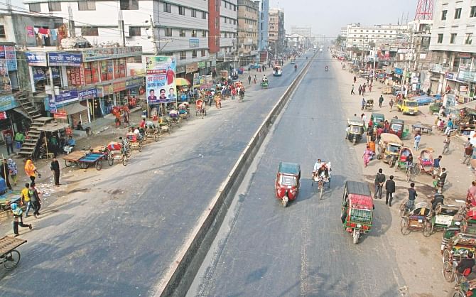 This Star photo shows only a handful of three-wheelers ply a thoroughfare in Gazipur yesterday. The 20-party alliance had called for a dawn-to-dusk hartal in the city on December 28 last year. 