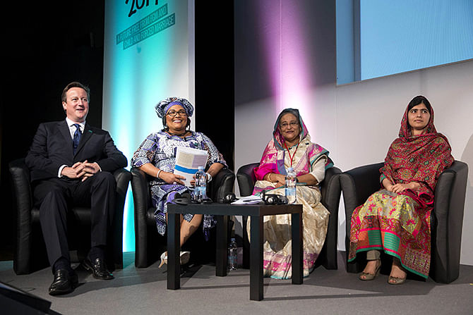 Prime Minister Sheikh Hasina sits with British Prime Minister David Cameron, left, Chantal Compaore the First Lady of Burkina Faso, and Pakistani rights activist Malala Yousafzai, right, at the “Girl Summit 2014” at Walworth Academy in London on July 22.
