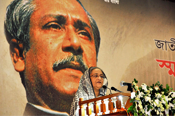 Prime Minister Sheikh Hasina addressing a discussion on National Mourning Day at Bangabandhu International Conference Centre on Saturday. Photo: BSS
