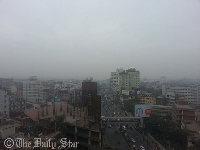 Thick fog covers the sun  on Saturday.   An aerial view of Dhaka city taken  The sun remains covered by the thick fog on Saturday. The aerial view of the city has been taken from Kazi Nazrul Islam Avenue in Dhaka in the morning. Photo: Sam Jahan