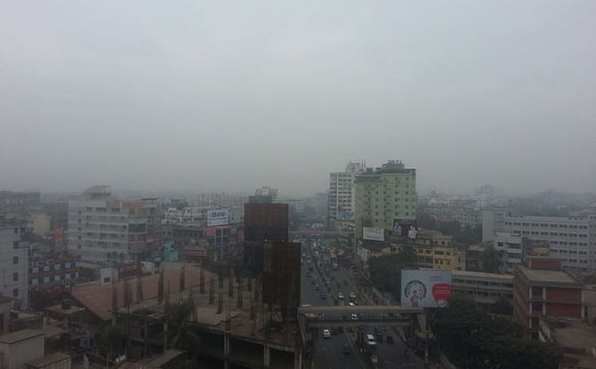 This December 13 Star photo shows thick fog covering the Sun in Dhaka city.
