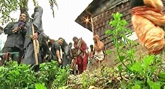Local administration force to leave the people, who live in at least 11 risky hills, suspecting hill slides following a heavy rainfall in Chittagong. Photo: TV grab 