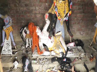 Vandalised idols of Hindu gods and goddesses lay scattered on the floor at Shashanghat Kali Mandir in Gopalpur of Netrakona on Friday. Photo: Star