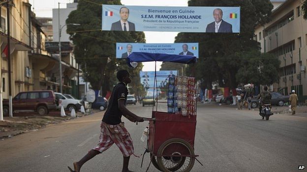 The streets of Conakry are festooned with French and Guinean flags ahead of Hollande's visit. Photo: BBC/AP