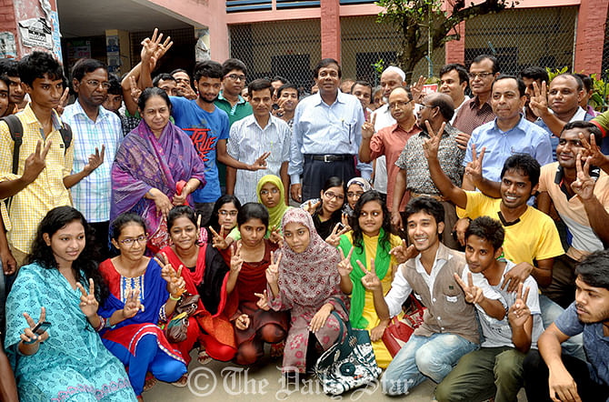 Jubilant students and teachers of Government Azizul Haque College in Bogra on Wednesday are celebrating their success in this year’s Higher Secondary Certificate (HSC) and equivalent examinations. The college secured third position under Rajshahi Education Board. Photo: Star