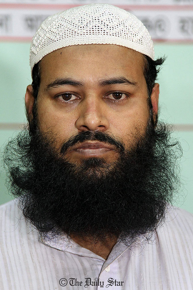 Maulana Abu Bakar alias Selim Hawlader is a top Huji leader and condemned convict in Ramna Batamul carnage case. Rapid Action Battalion members arrest him Wednesday night. Photo: SK Enamul Haq